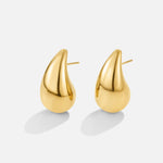 Anne – Boucles d'oreilles créoles en or avec une courbe délicate